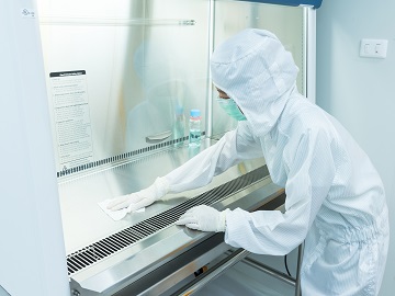 Testing of disinfectant used by laboratory employee for cleaning surface