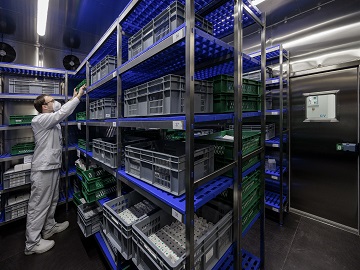 Eurofins employee storing samples in the stability storage room for stability testing