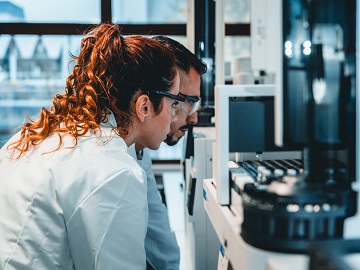 Employees performing TOC analysis as part of chemical characterisation activities for medical device