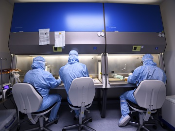 Eurofins employees performing activities in cleanroom as part of our GMP manufacturing services